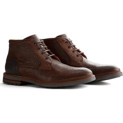 Skórzane sneakersy "Backhill" w kolorze brązowym. Pomarańczowe sneakersy męskie Travelin', na sznurówki. W wyprzedaży za 299,95 zł.