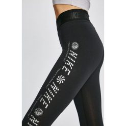 Nike Sportswear - Legginsy. Żółte spodnie damskie Nike Sportswear, s, bez wzorów, z elastanu. W wyprzedaży za 79,90 zł.