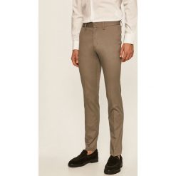 Tommy Hilfiger - Spodnie. Szare spodnie męskie TOMMY HILFIGER, na co dzień, z haftami, z elastanu. Za 449,90 zł.