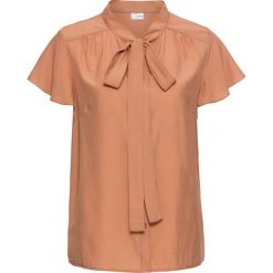 Bluzka z krawatką, krótki rękaw bonprix jasny koniakowy. Pomarańczowe koszulki damskie marki bonprix, bez wzorów, eleganckie, bez kołnierzyka, z krótkim rękawem. Za 44,99 zł.