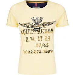 T-shirt AERONAUTICA MILITARE. Żółte bluzki damskie Aeronautica Militare, z nadrukiem, z bawełny, militarne, z okrągłym kołnierzem, bez rękawów. W wyprzedaży za 205,00 zł.