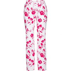 Spodnie lniane z nadrukiem bonprix biało-różowy hibiskus z nadrukiem. Spodnie damskie bonprix. Za 54,99 zł.