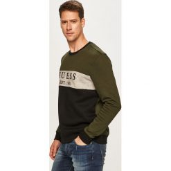 Guess Jeans - Bluza. Żółte bluzy męskie Guess Jeans, xl, z aplikacjami, z elastanu, z okrągłym kołnierzem, bez rękawów, bez kaptura. W wyprzedaży za 249,90 zł.