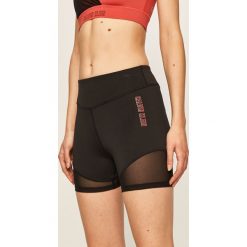 Calvin Klein Performance - Szorty. Czarne spodenki sportowe damskie Calvin Klein Performance, s, z nadrukiem, z elastanu, sportowe. Za 249,90 zł.