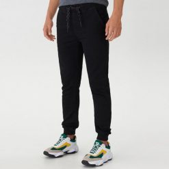 Jeansowe joggery - Czarny. Czarne spodnie męskie House, m, bez wzorów, z jeansu. Za 129,99 zł.