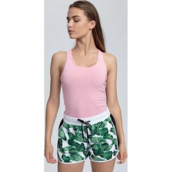 Top damski TSD001 - jasny róż. Różowe topy damskie marki 4f, z bawełny. W wyprzedaży za 34,99 zł.