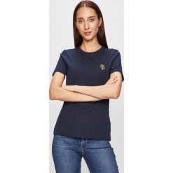 Tommy Hilfiger - T-shirt. Białe bluzki damskie TOMMY HILFIGER, s, bez wzorów, z bawełny, z okrągłym kołnierzem. W wyprzedaży za 149,90 zł.