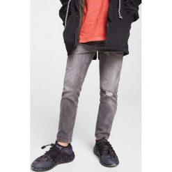 Mango Kids - Jeansy dziecięce John 104-164 cm. Szare jeansy męskie marki Mango Kids, z elastanu. W wyprzedaży za 49,90 zł.