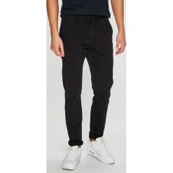 Tommy Hilfiger - Spodnie. Czarne chinosy męskie marki TOMMY HILFIGER, s, z elastanu. W wyprzedaży za 319,90 zł.
