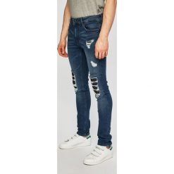Guess Jeans - Jeansy Miami. Niebieskie jeansy męskie Guess Jeans, m, z aplikacjami. Za 539,90 zł.