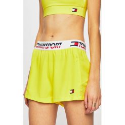 Tommy Sport - Szorty sportowe. Żółte spodenki sportowe damskie Tommy Sport, s, bez wzorów, z poliesteru, sportowe. W wyprzedaży za 139,90 zł.