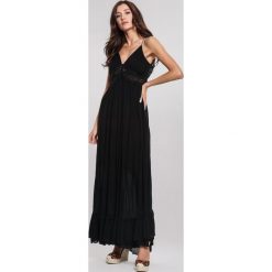 Czarna Sukienka Buzzing. Czarne sukienki damskie other, na plażę, na lato, s, w koronkowe wzory, z koronki, eleganckie, bez kołnierzyka, bez rękawów, maxi. Za 129,99 zł.