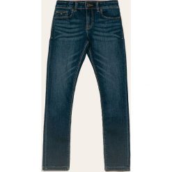 Tommy Hilfiger - Jeansy dziecięce 128-176 cm. Niebieskie jeansy dziewczęce TOMMY HILFIGER, bez wzorów, z elastanu. W wyprzedaży za 199,90 zł.