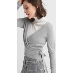 Golfy damskie: Sweter wiązany kopertowo