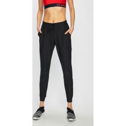Under Armour - Spodnie. Czarne spodnie sportowe damskie marki Under Armour, s, z poliesteru. Za 269,90 zł.