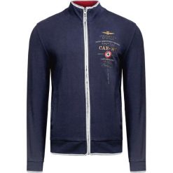 Bluza AERONAUTICA MILITARE. Niebieskie bluzy męskie Aeronautica Militare, z haftami, z kontrastowym kołnierzykiem, bez rękawów, bez kaptura. W wyprzedaży za 492,00 zł.