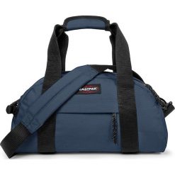 Torba podróżna "Compact" w kolorze niebieskim - 45,5 x 23 x 20 cm - 23 l. Niebieskie torby podróżne Eastpak, w paski, z materiału. W wyprzedaży za 107,95 zł.