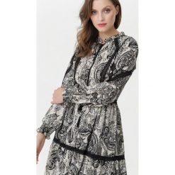 Czarna Sukienka Frisco. Czarne sukienki damskie Born2be, na imprezę, s, w koronkowe wzory, z koronki, boho, ze stójką, bez rękawów, długie, midi. Za 269,99 zł.