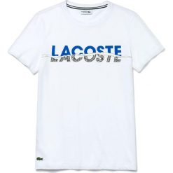 LACOSTE T-SHIRT > TH4907-Y6G. Czarne koszulki męskie Lacoste, xl, z napisami, z bawełny, eleganckie, bez kołnierzyka. W wyprzedaży za 169,99 zł.