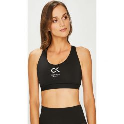 Calvin Klein Performance - Biustonosz. Białe biustonosze Calvin Klein Performance, s, z nadrukiem, z elastanu. W wyprzedaży za 139,90 zł.