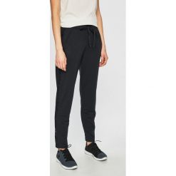 Under Armour - Spodnie. Czarne spodnie sportowe damskie marki Under Armour, s, z elastanu. Za 259,90 zł.