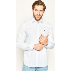 Koszula Lacoste CH7684. Niebieskie koszule męskie Lacoste, m, bez wzorów, z bawełny, casualowe, bez kołnierzyka, bez rękawów. W wyprzedaży za 299,00 zł.