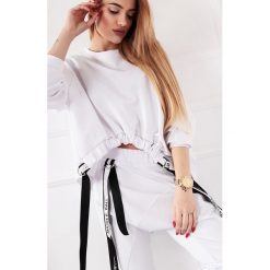 Oversize'owa bluza z asymetrycznym dołem z szelkami. Bluzy damskie Made in Poland, uniwersalny, bez wzorów, z elastanu, bez rękawów, bez kaptura. Za 199,00 zł.
