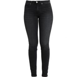 Calvin Klein Jeans CKJ 011 MID RISE SKINNY Jeans Skinny Fit stockholm black. Czarne jeansy damskie relaxed fit Calvin Klein Jeans, z bawełny. Za 449,00 zł.