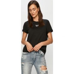 Reebok Classic - T-shirt. Czarne topy damskie Reebok Classic, s, z aplikacjami, z elastanu, z okrągłym kołnierzem. Za 89,90 zł.