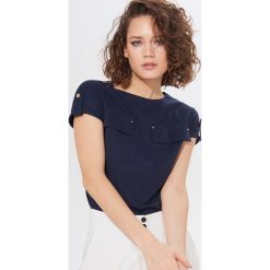 Koszulka z bawełną organiczną Eco Aware - Niebieski. Niebieskie koszulki damskie Mohito, s, bez wzorów, z bawełny, bez kołnierzyka, bez rękawów. Za 59,99 zł.