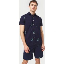 O'Neill Palm All Over Koszula Niebieski. Niebieskie koszule męskie O'Neill, xl, bez wzorów, z bawełny, bez kołnierzyka, z krótkim rękawem. Za 223,95 zł.