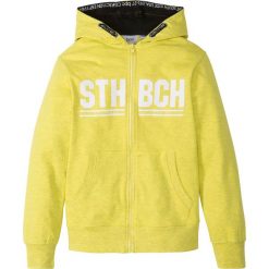 Bluza rozpinana z kapturem bonprix żółty melanż z nadrukiem. Żółte bluzy dziewczęce marki bonprix, z nadrukiem, z kapturem. Za 59,99 zł.