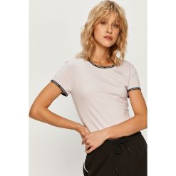 Calvin Klein Jeans - T-shirt. Czarne bluzki damskie Calvin Klein Jeans, s, z aplikacjami, z elastanu, casualowe, z okrągłym kołnierzem, z krótkim rękawem. Za 179,90 zł.