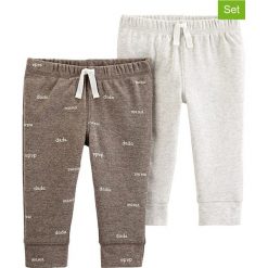 Spodnie (2 pary) w kolorze brązowo-szarym. Spodnie niemowlęce Carter's. W wyprzedaży za 42,95 zł.