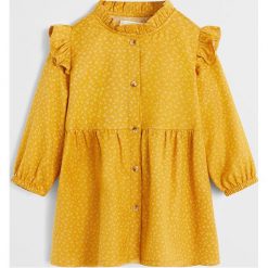 Mango Kids - Spodnie dziecięce Nora 80-104 cm. Żółte spodnie dziewczęce Mango Kids, bez wzorów, z bawełny, casualowe, długie. Za 79,90 zł.