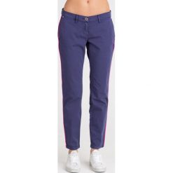 SPODNIE Trussardi Jeans. Niebieskie spodnie damskie Trussardi Jeans, z jeansu, z obniżonym stanem. Za 203,40 zł.