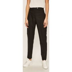 Calvin Klein - Spodnie. Czarne spodnie damskie Calvin Klein, z elastanu. W wyprzedaży za 559,90 zł.