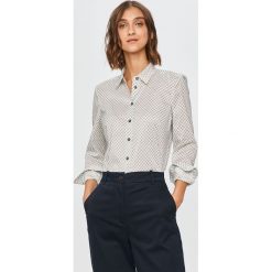 Tommy Hilfiger - Koszula. Białe bluzki damskie TOMMY HILFIGER, na co dzień, bez wzorów, z bawełny, klasyczne, z klasycznym kołnierzykiem, z długim rękawem. Za 399,90 zł.