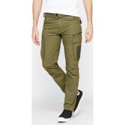 Spodnie bojówki slim Cargo US 70. Brązowe bojówki męskie marki Schott NYC, z bawełny. Za 251,79 zł.