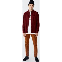 Spodnie slim fit z 5 kieszeniami. Szare spodnie męskie marki Pull&Bear, m, bez wzorów. Za 89,90 zł.