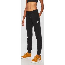 Nike Sportswear - Spodnie. Czarne spodnie damskie Nike Sportswear, s, bez wzorów, z bawełny, casualowe. Za 159,90 zł.