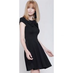 Czarna Sukienka Controlled Love. Czarne sukienki damskie other, bez wzorów, bez kołnierzyka, bez rękawów, mini. Za 59,99 zł.