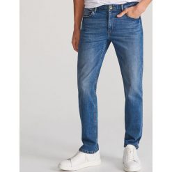 Jeansy z bawelny organicznej - Granatowy. Niebieskie jeansy męskie Reserved, m. Za 129,99 zł.