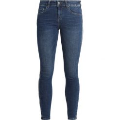 Cartoon Jeansy Slim Fit middle/blue/denim. Niebieskie jeansy damskie marki Cartoon, bez wzorów, z elastanu. Za 379,00 zł.