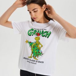 Koszulka z nadrukiem Grinch - Biały. Białe koszulki damskie Cropp, s, z nadrukiem, bez kołnierzyka, bez rękawów. Za 49,99 zł.