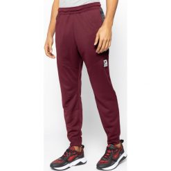 Spodnie dresowe NIKE Air Max CJ5649. Czerwone jeansy męskie Nike, m, bez wzorów, z poliesteru. W wyprzedaży za 229,00 zł.