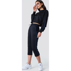 NA-KD Spodnie sportowe - Black. Czarne bryczesy damskie NA-KD, z poliesteru. W wyprzedaży za 70,98 zł.
