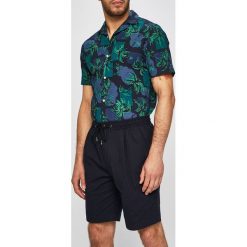 Tommy Hilfiger - Szorty. Brązowe spodenki i szorty męskie TOMMY HILFIGER, s, bez wzorów, z elastanu, casualowe. W wyprzedaży za 249,90 zł.