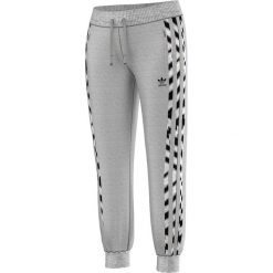 Adidas Spodnie Zebra Flock szare r. 40 (M30507). Spodnie dresowe damskie Adidas, m, z motywem zwierzęcym. Za 155,06 zł.