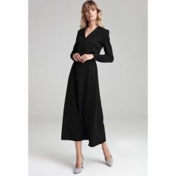 Sukienka maxi z długim rękawem czarna - 44. Czarne sukienki damskie e-margeritka.pl, do pracy, uniwersalny, bez wzorów, z poliesteru, eleganckie, bez kołnierzyka, z długim rękawem, długie, maxi, dopasowane. Za 199,99 zł.